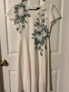 Elegant White Midi Dress with Grayish Green Floral Appliqué
